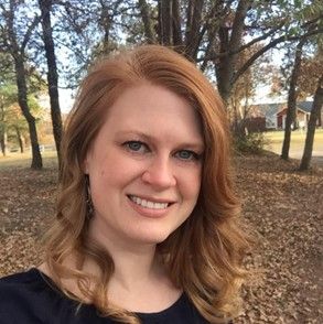 Woman with medium length red hair